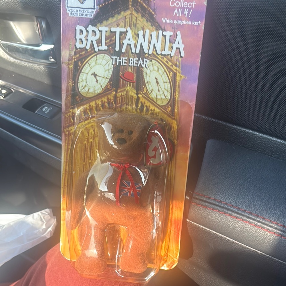Brown and Red Collectible Bear Figure with Clock Tower Imagery